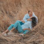 Sweet Couple on Brown Grass Field